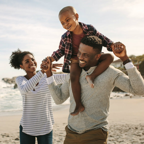 family playing on a beach